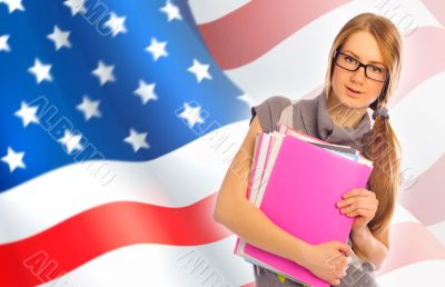 Portrait of pretty young woman holding book in her arms. USA Fla