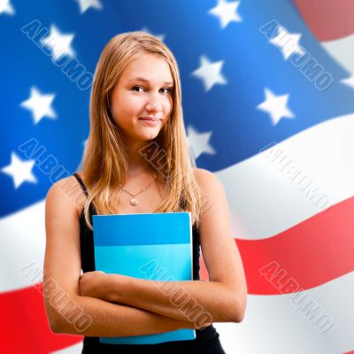 Portrait of pretty young woman holding book in her arms. USA Fla