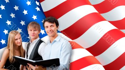 Group of young students standing with their teacher against Amer