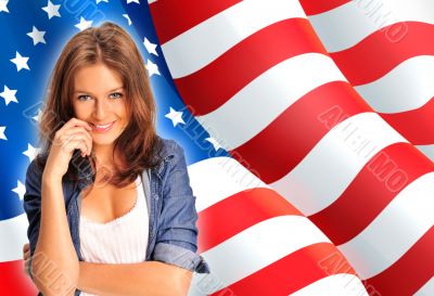 Portrait of a pretty young woman &ocirc;&iuml;&ocirc;&oslash;&ograve;&ucirc;&aring; an American flag , smil