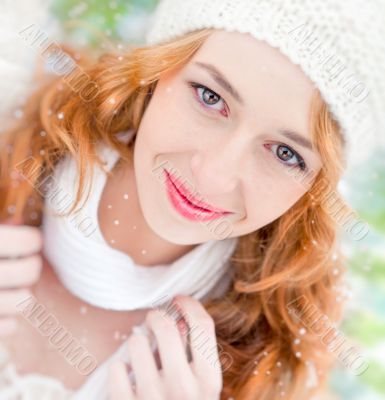 Portrait of beautiful young red hair woman outdoors in winter lo