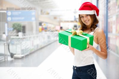 Portrait of young excited pretty woman wearing Santa Claus helpe