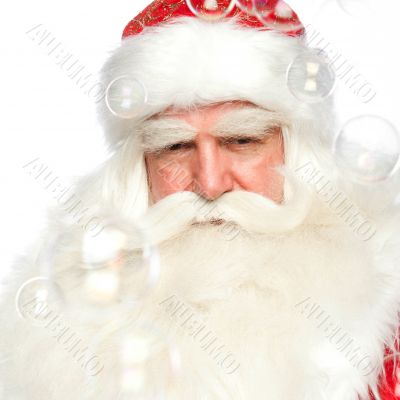 Santa Claus portrait smiling isolated over a white background an
