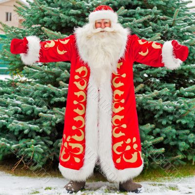 Full Length Portrait of Santa Claus standing with open hands out