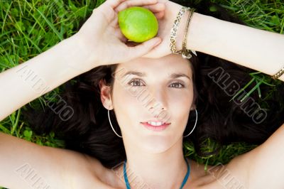 Pretty brunette woman wearing elegant dress relaxing outdoor in 