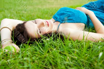 Pretty brunette woman wearing elegant dress relaxing outdoor in 