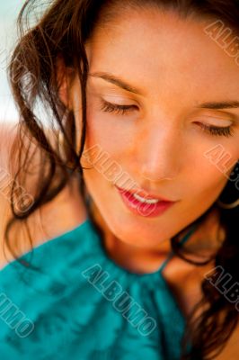 Pretty young woman with hot look and sexy smile sitting near poo