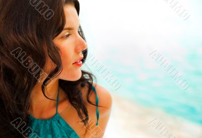 Pretty young woman with hot look and sexy smile sitting near poo