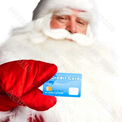 Traditional Santa Claus holding and sowing credit card while giv