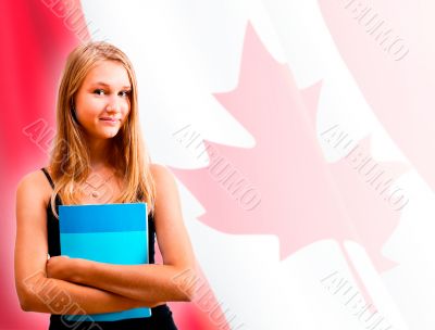 Portrait of pretty young woman holding book in her arms. Canadia