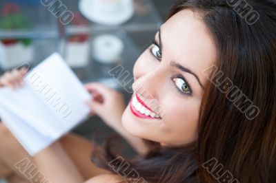 Closeup portrait of a lovely young woman writing a diary