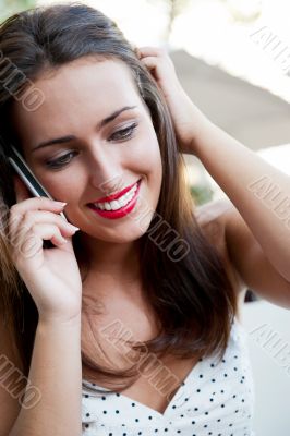 Closeup portrait of a pretty young female sitting at cafe in mor