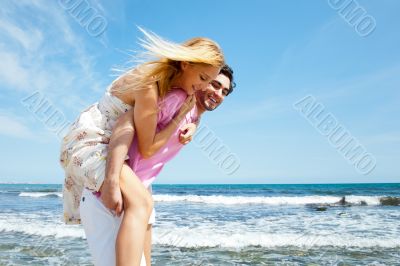 Couple in love - Hispanic man having his caucasian woman piggyba