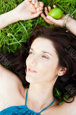 Pretty brunette girl wearing elegant dress relaxing outdoor in g