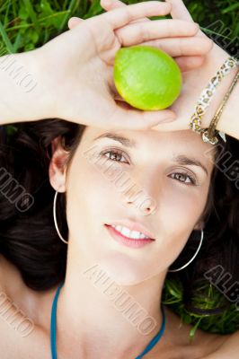 Pretty brunette woman wearing elegant dress relaxing outdoor in 