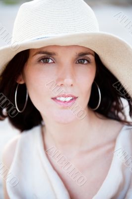 Summer portrait of beautiful woman wearing hat. Vacation at warm