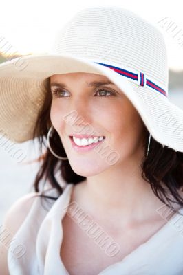Summer portrait of beautiful woman wearing hat. Vacation at warm