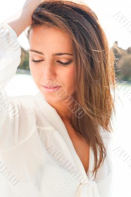 Portrait of beautiful hispanic woman posing and dancing outdoors