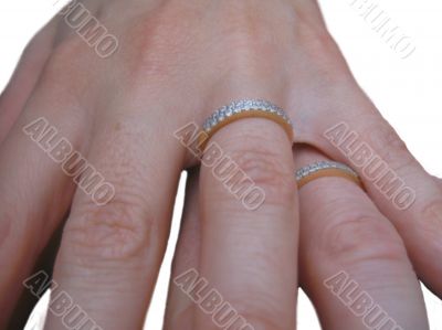 Two hands two rings and two hearts