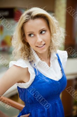 Portrait of a beautiful thoughtful woman smiling intdoors