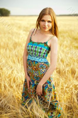 Young happy woman in field