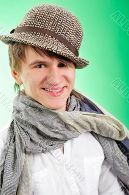 Portrait of a handsome young man over green background