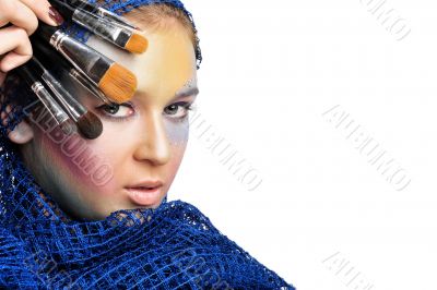 Portrait of a beautiful young women wearing a lot of makeup.