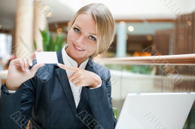 Portrait of a pretty businesswoman sitting at cafe with a laptop