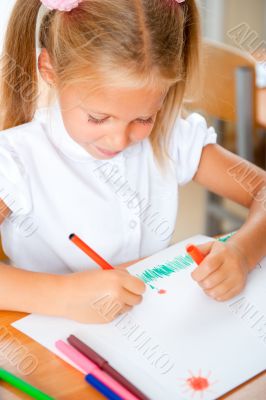 Little girl looking for a drawing concept wile painting picture 