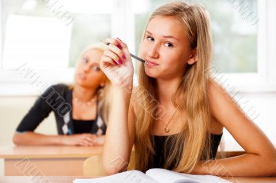 Portrait of a young group of students paying attention in class.