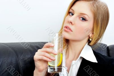Closeup portrait of young business woman drinking water with nat