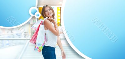 Happy shopping woman at the mall preparing gifts for her friends