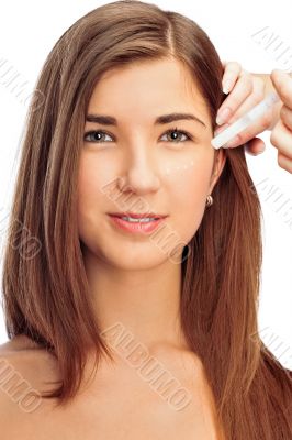 Face part of beautiful woman with cream on face on white backgro