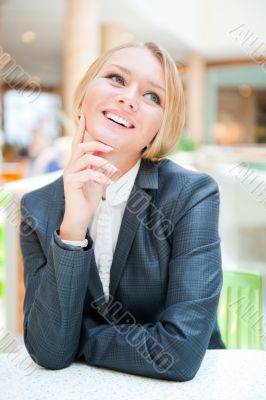 Portrait of a pretty businesswoman sitting at her desk