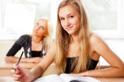 Portrait of a young group of students paying attention in class.