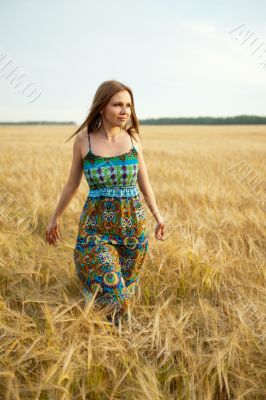 Young happy woman in field