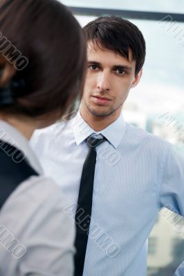 Two contemporary business people at a meeting