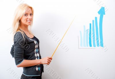 Young business teacher showing growing profit with graph on whit