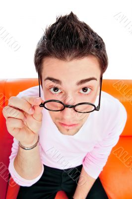 View from above of man in glasses looking at camera with hands o