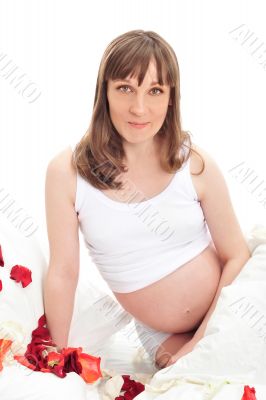 Image of pregnant woman touching her belly with hands