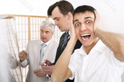 Portrait of a seminar and one man confused.