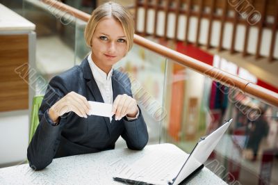 Portrait of a pretty businesswoman sitting at cafe with a laptop