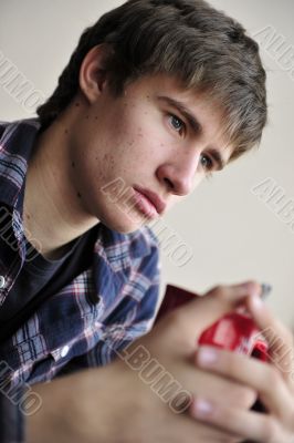 Happy young handsome man at home