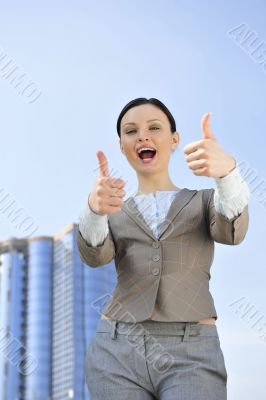 Portrait of a beautiful young businesswoman celebrating.