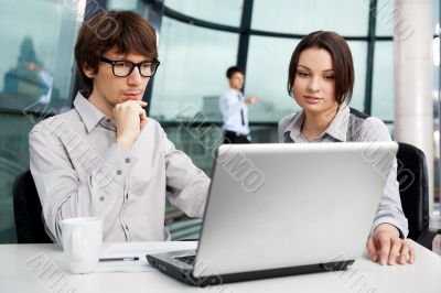 Portrait of confident business man explaining a project to colle