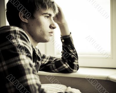 Happy young handsome man at home