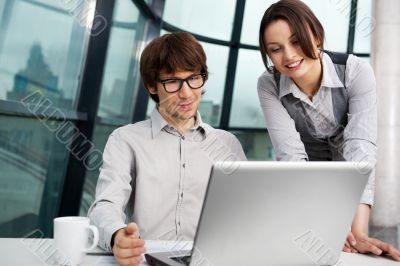 Portrait of confident business man explaining a project to colle