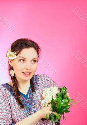 Portrait of a beautiful young girl in Asian clothing, looking to