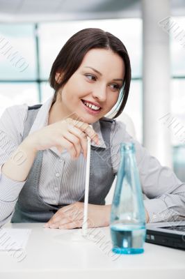 Smiling pretty business woman with microphone. She is salesperso