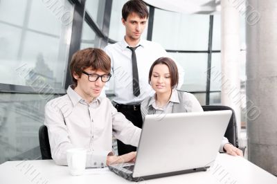 Portrait of confident business man explaining a project to colle